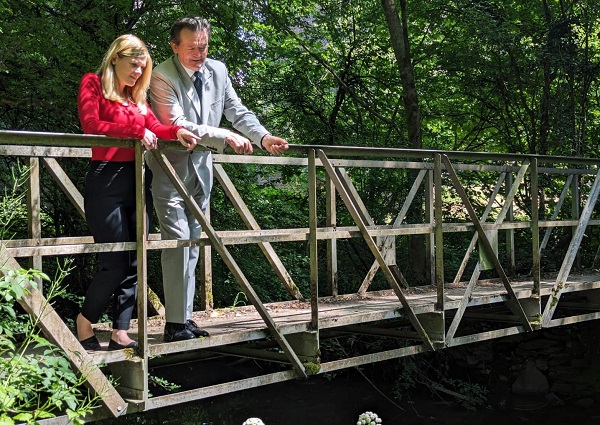 Clean rivers campaigner Feargal Sharkey with Claire Hazelgrove on a bridge over the Frome in Winterbourne