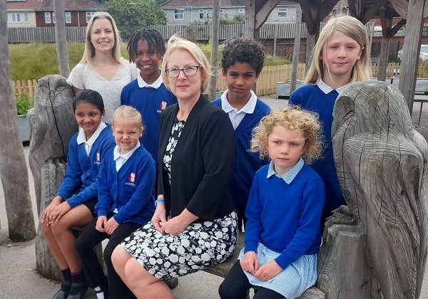 Principal Jenny Harvey with staff and pupils of Minerva Primary Academy.